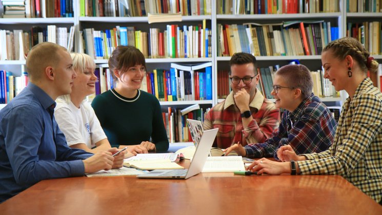 students in library smiling